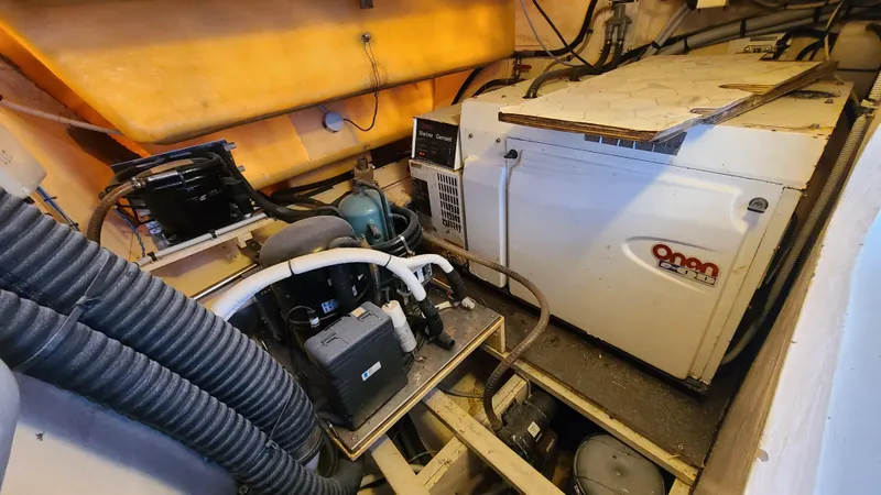 Pono Yacht Photos Pics Engine room of 2005 Fountaine Pajot FP Eleuthera 60 catamaran with Onan generator.