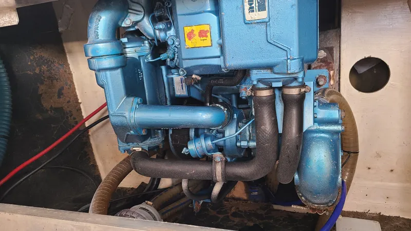 Pono Yacht Photos Pics Engine compartment of 2005 Fountaine Pajot FP Eleuthera 60 catamaran, featuring blue machinery.