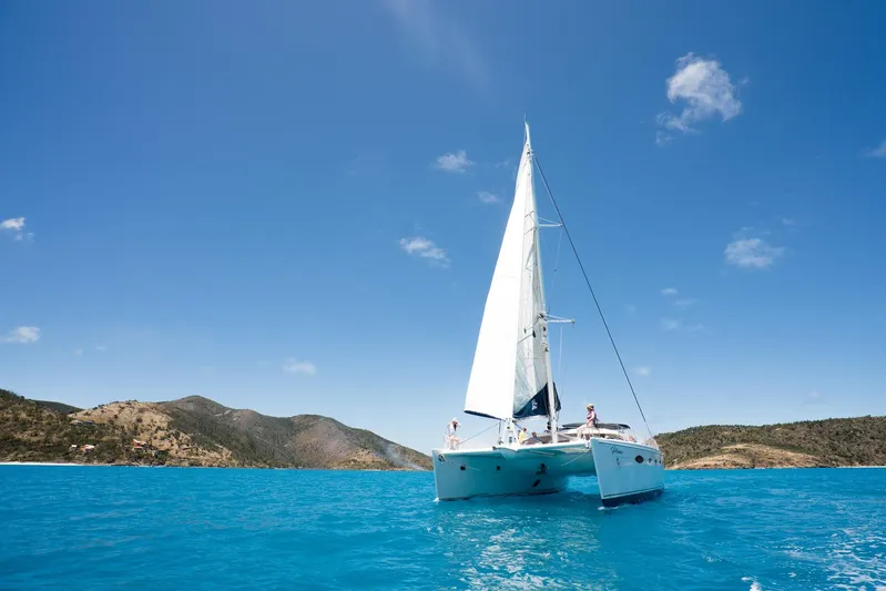 Pono Yacht Photos Pics Sailing catamaran Fountaine Pajot FP Eleuthera 60 on clear blue water, 2005 model.