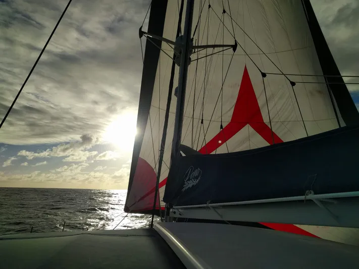 Pono Yacht Photos Pics Sailing catamaran Fountaine Pajot FP Eleuthera 60 at sunset, 2005 model.