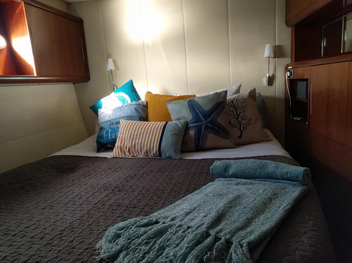 Pono Yacht Photos Pics Cozy bedroom in 2005 Fountaine Pajot FP Eleuthera 60 yacht with decorative pillows.