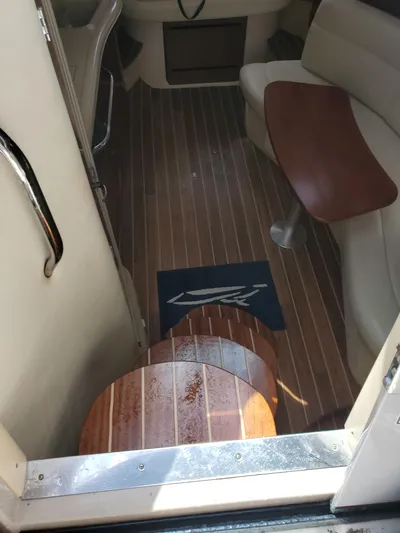  Yacht Photos Pics Interior view of 2006 Sea Ray Sundancer with wooden flooring and seating area.