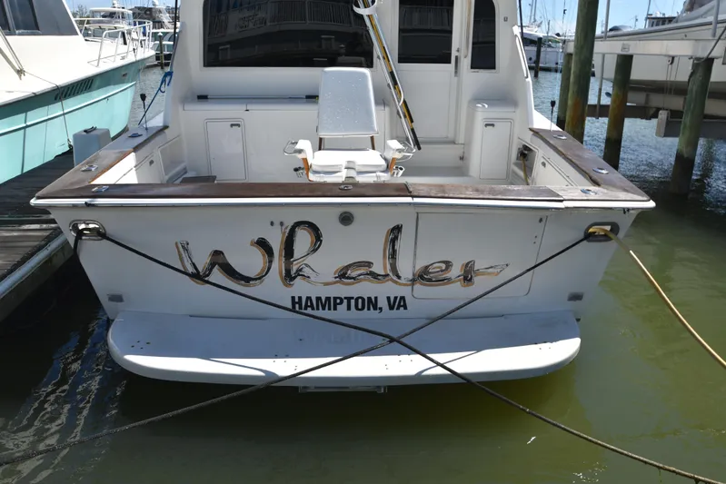 Whaler Yacht Photos Pics 1997 Ocean 48 Convertible boat docked, named "Whaler," in Hampton, VA marina.