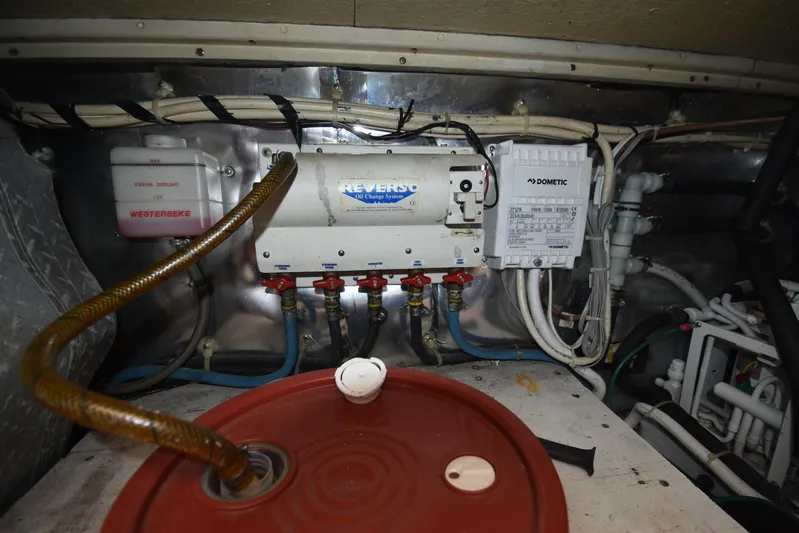Whaler Yacht Photos Pics Engine room of 1997 Ocean 48 Convertible with Reverso oil change system and Dometic components.