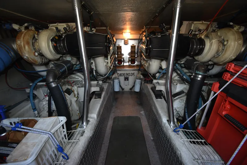 Whaler Yacht Photos Pics Engine room of a 1997 Ocean 48 Convertible yacht, featuring dual engines and equipment.