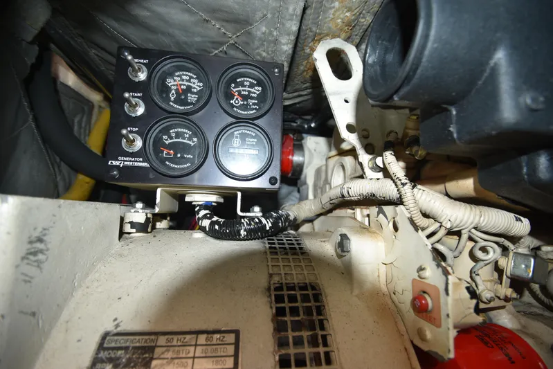 Whaler Yacht Photos Pics Engine compartment of a 1997 Ocean 48 Convertible with control panel and wiring.