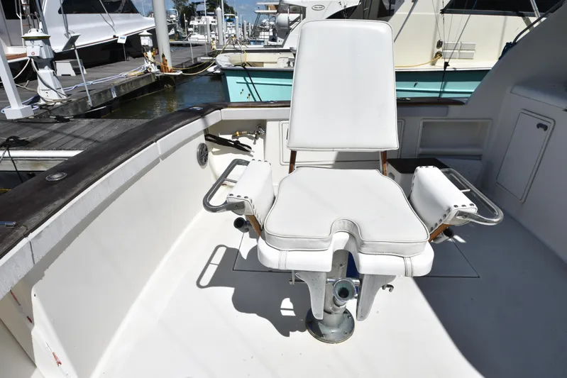 Whaler Yacht Photos Pics Fishing chair on 1997 Ocean 48 Convertible yacht deck at marina.
