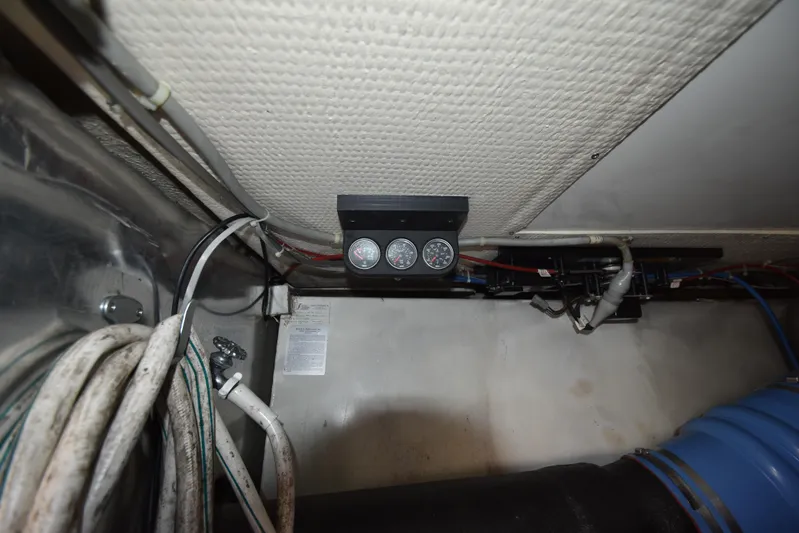 Whaler Yacht Photos Pics Engine room of 1997 Ocean 48 Convertible yacht with gauges and wiring.