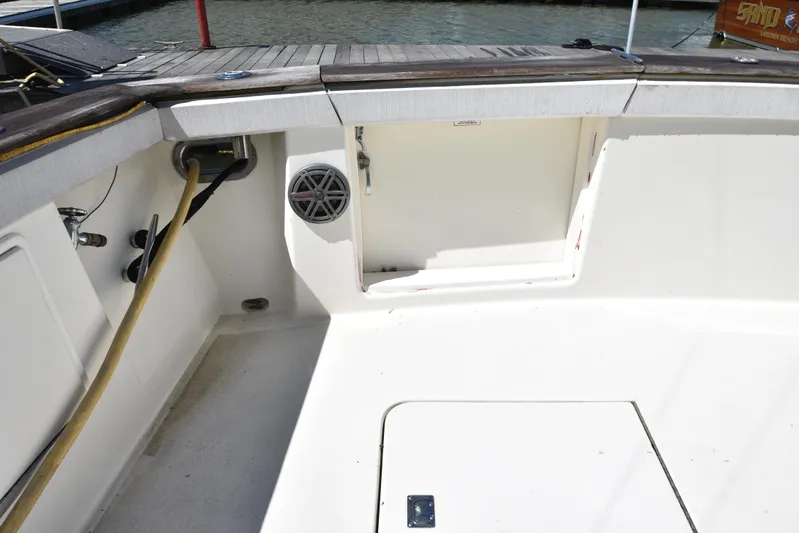 Whaler Yacht Photos Pics 1997 Ocean 48 Convertible yacht deck with storage compartment and speaker.