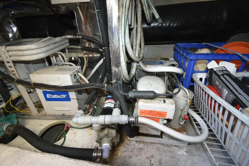 Whaler Yacht Photos Pics Engine room of 1997 Ocean 48 Convertible with Cruisair system and various equipment.