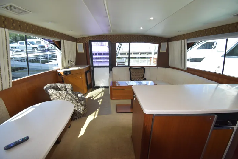 Whaler Yacht Photos Pics Luxurious interior of a 1997 Ocean 48 Convertible yacht with modern furnishings.