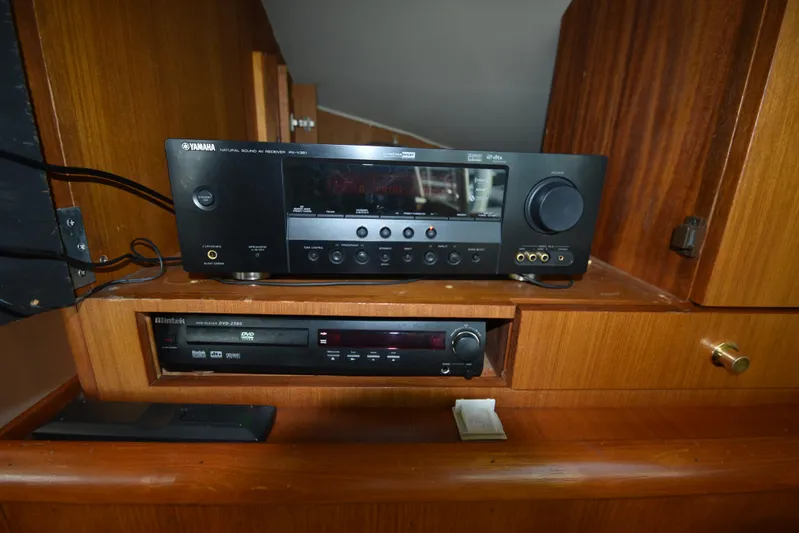 Whaler Yacht Photos Pics Yamaha AV receiver and DVD player in wooden cabinet on 1997 Ocean 48 Convertible yacht.