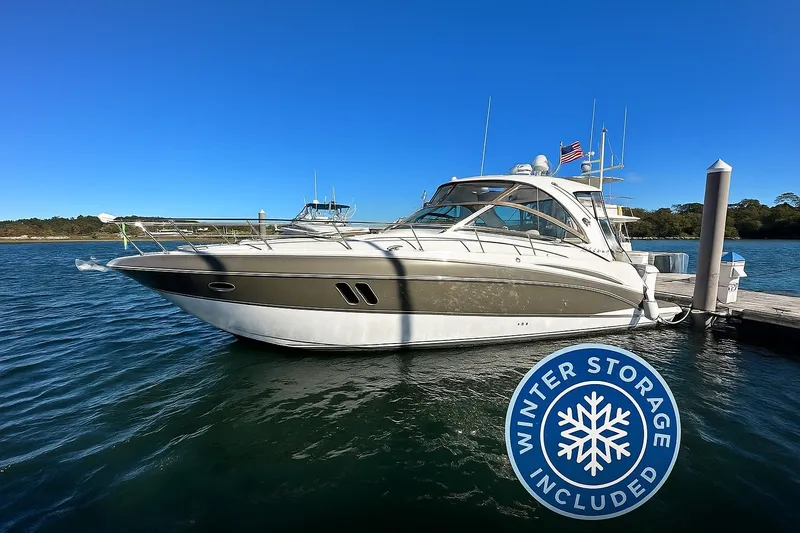 Brown Eyed Girl Yacht Photos Pics 2014 Cruisers Yachts 380 Express docked, winter storage included, clear blue sky.