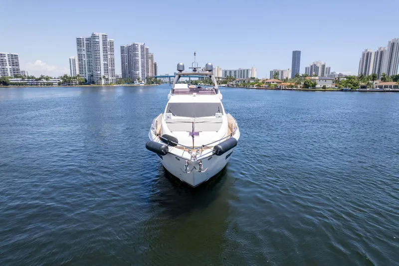  Yacht Photos Pics 2015 Ferretti Yachts 750 on water with city skyline in background.