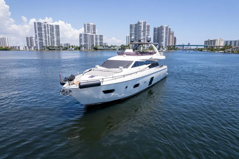  Yacht Photos Pics 2015 Ferretti Yachts 750 cruising in a city waterfront with skyscrapers.