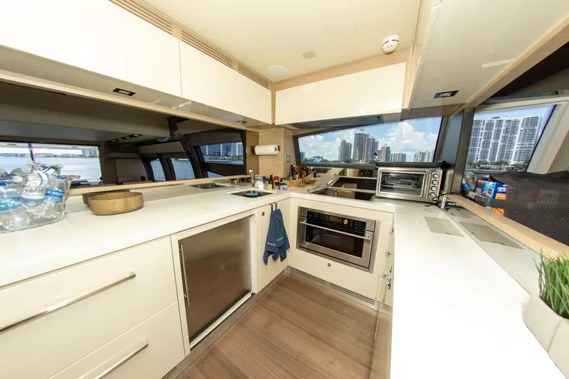  Yacht Photos Pics Modern kitchen interior on a 2015 Ferretti Yachts 750, featuring sleek cabinetry and appliances.