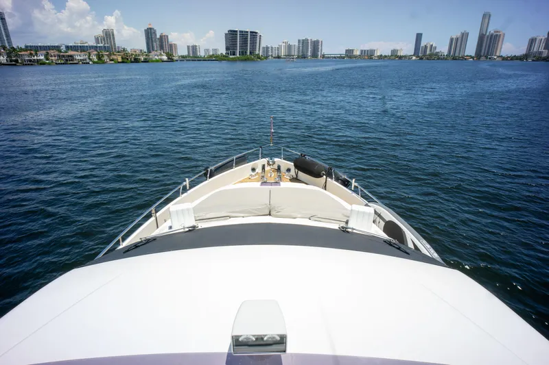  Yacht Photos Pics Bow view of 2015 Ferretti Yachts 750 cruising near city skyline.