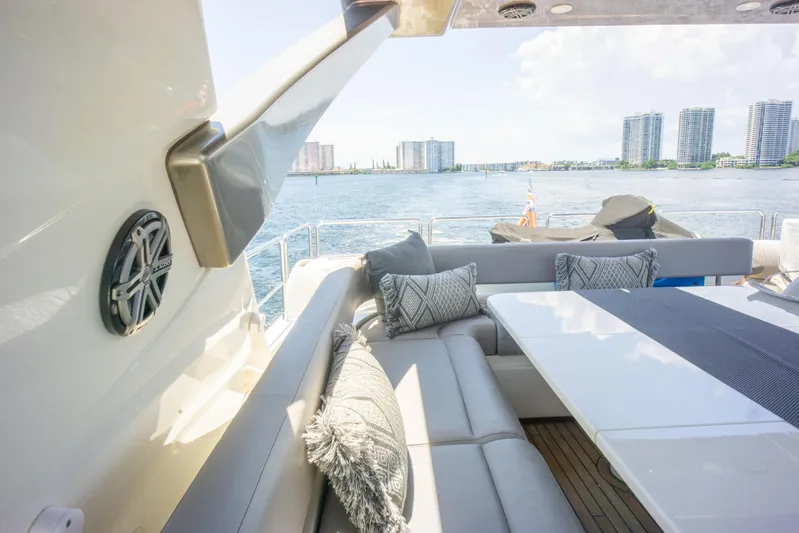  Yacht Photos Pics Luxurious seating area on a 2015 Ferretti Yachts 750 with waterfront city views.