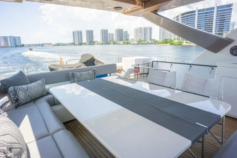  Yacht Photos Pics Luxurious 2015 Ferretti Yachts 750 with elegant outdoor seating and scenic waterfront view.