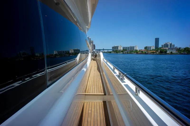  Yacht Photos Pics 2015 Ferretti Yachts 750, sleek deck view, city skyline, blue sky, waterfront.