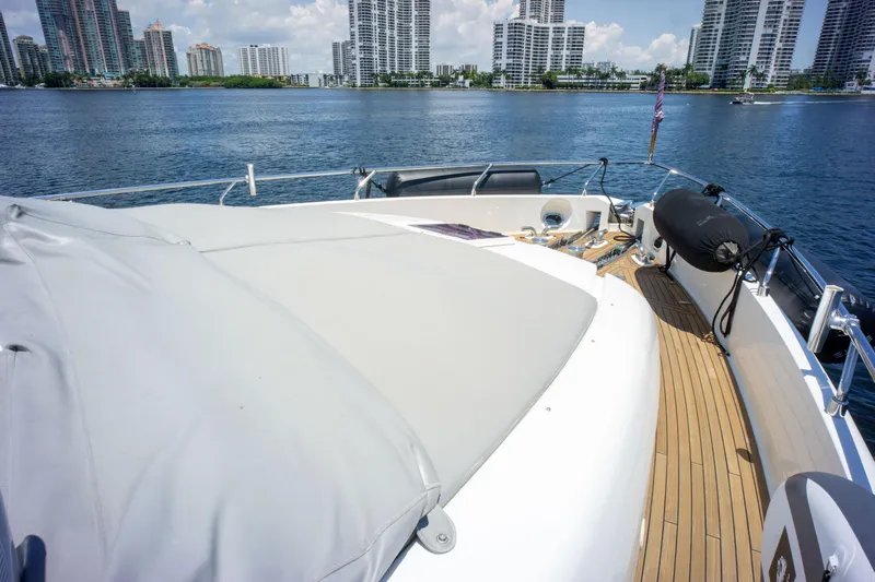  Yacht Photos Pics Ferretti Yachts 750 (2015) on water, showcasing deck and city skyline in background.
