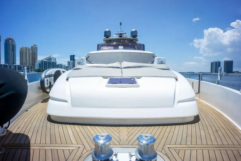  Yacht Photos Pics Luxurious 2015 Ferretti Yachts 750 on deck, city skyline in background.