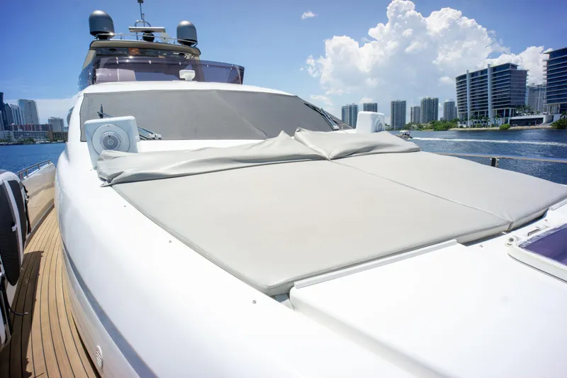  Yacht Photos Pics Luxurious 2015 Ferretti Yachts 750 with spacious sun deck, city skyline in background.