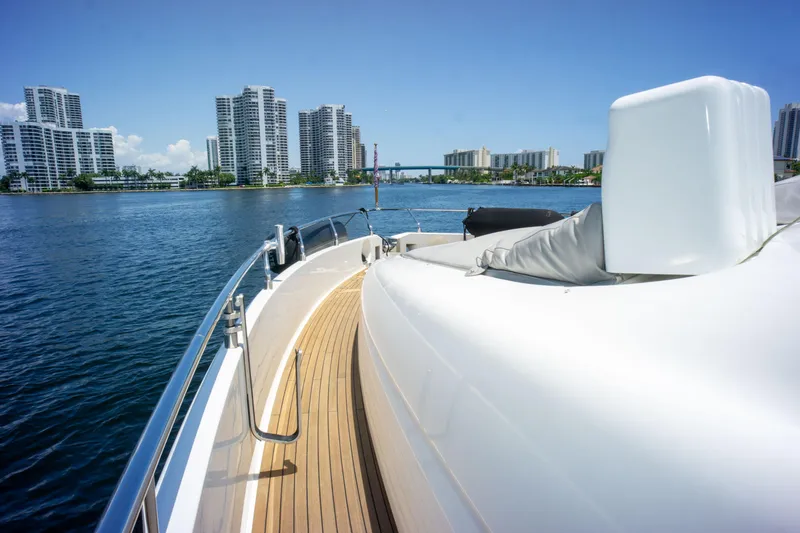  Yacht Photos Pics Luxurious 2015 Ferretti Yachts 750 cruising near modern city skyline.