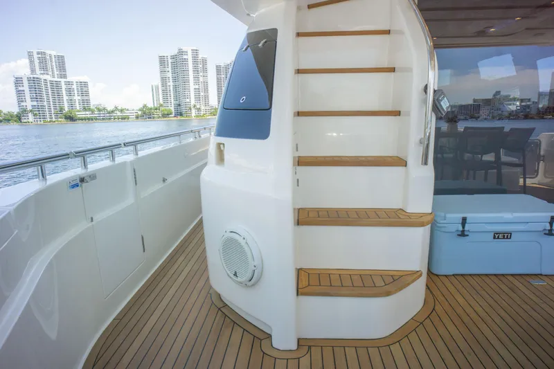  Yacht Photos Pics Luxurious 2015 Ferretti Yachts 750 deck with wooden stairs and waterfront view.