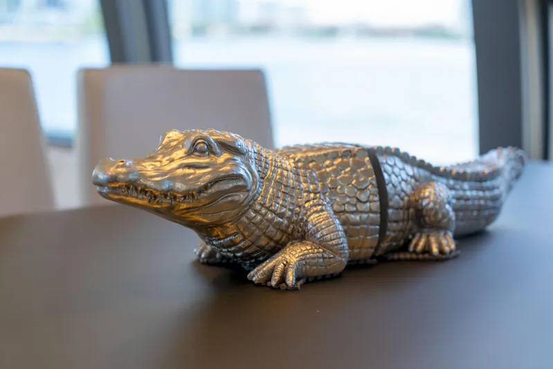  Yacht Photos Pics Decorative alligator sculpture on Ferretti Yachts 750, 2015 model, interior table.