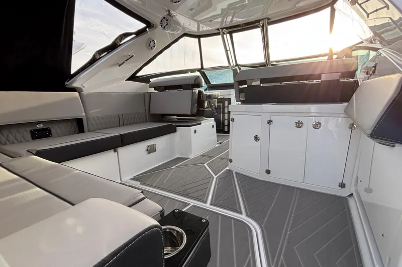  Yacht Photos Pics Luxurious interior of 2026 Monterey 385 Super Express yacht with modern seating and cabinetry.