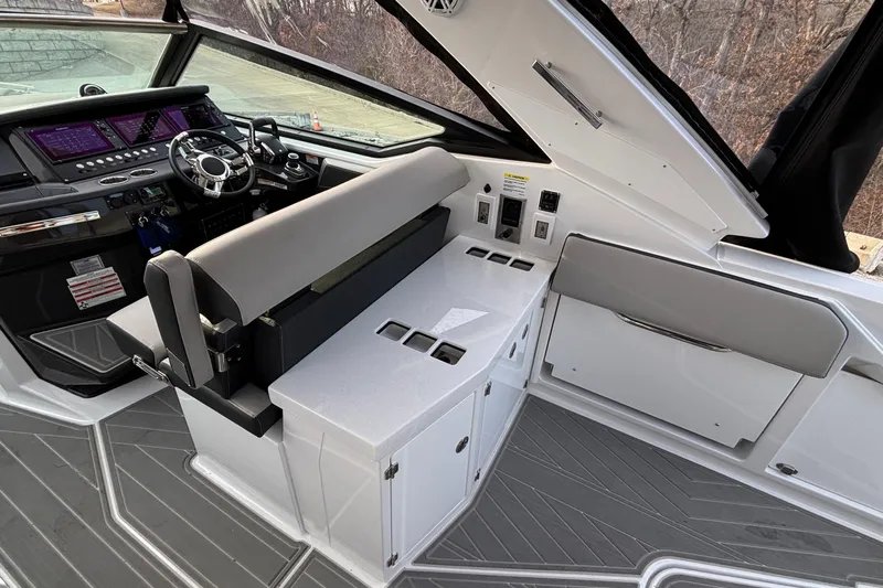  Yacht Photos Pics 2026 Monterey 385 Super Express cockpit with modern controls and sleek seating.