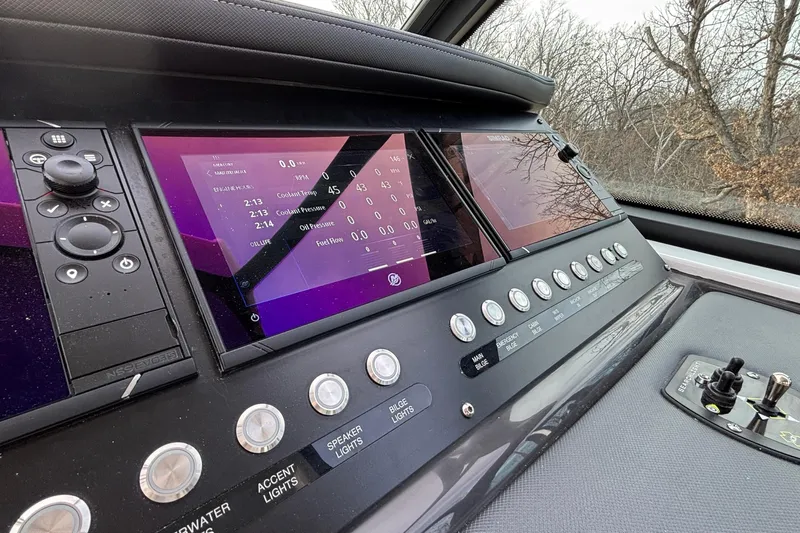  Yacht Photos Pics Dashboard of 2026 Monterey 385 Super Express with digital displays and control buttons.