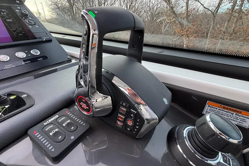  Yacht Photos Pics Control panel of 2026 Monterey 385 Super Express boat with throttle and navigation controls.