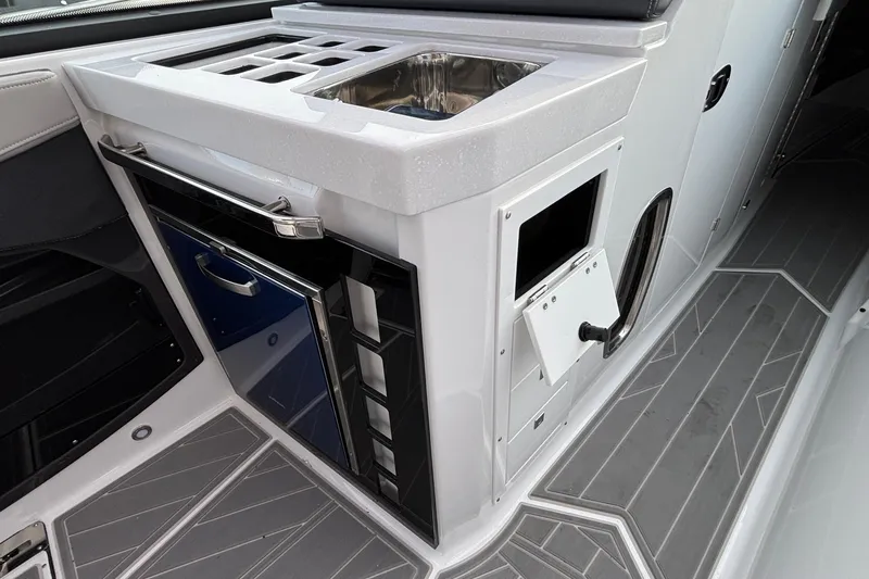  Yacht Photos Pics 2026 Monterey 385 Super Express boat interior with sleek kitchenette and modern design.