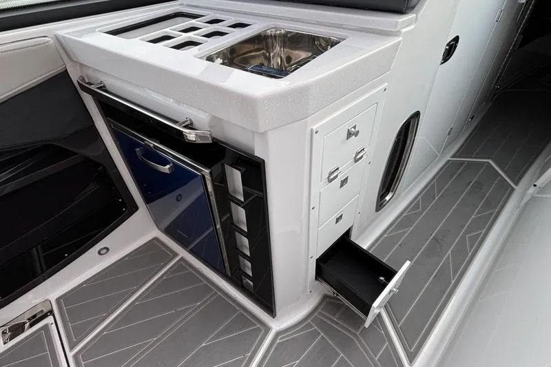  Yacht Photos Pics 2026 Monterey 385 Super Express boat interior with sink, storage, and sleek design.