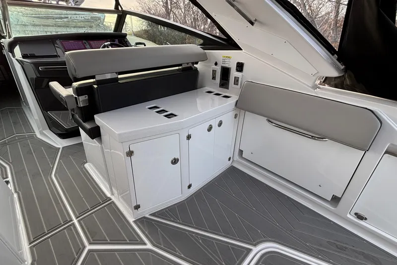  Yacht Photos Pics 2026 Monterey 385 Super Express interior with sleek seating and modern dashboard design.