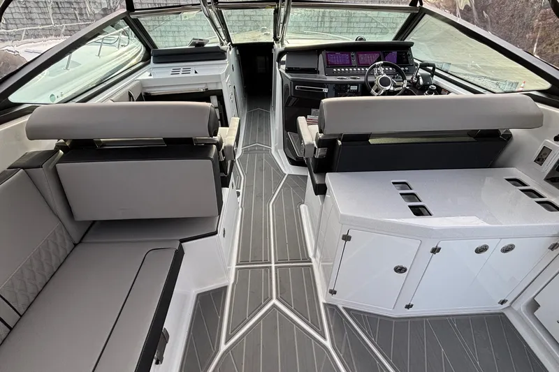  Yacht Photos Pics Interior of 2026 Monterey 385 Super Express boat with modern seating and sleek dashboard design.