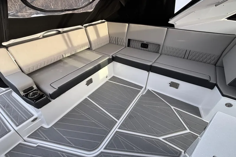  Yacht Photos Pics Luxurious seating area on 2026 Monterey 385 Super Express boat with modern design and gray upholstery.