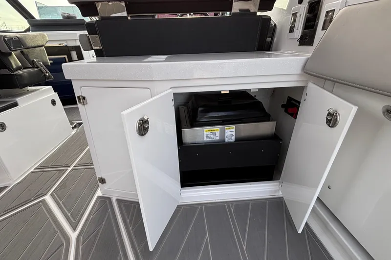  Yacht Photos Pics 2026 Monterey 385 Super Express interior with open storage compartment and modern design.