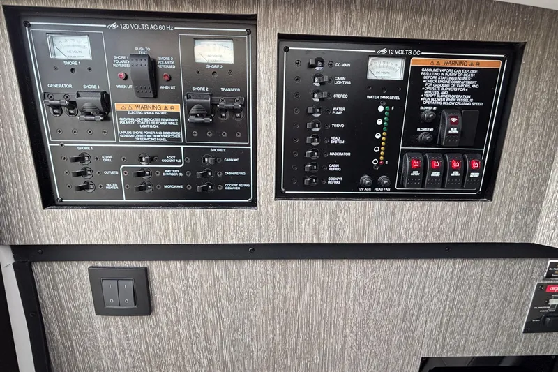  Yacht Photos Pics Electrical control panel of a 2026 Monterey 385 Super Express boat, featuring AC and DC systems.