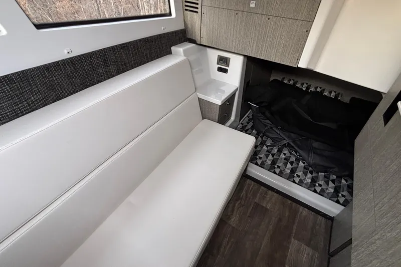  Yacht Photos Pics Interior of 2026 Monterey 385 Super Express boat with seating and sleeping area.