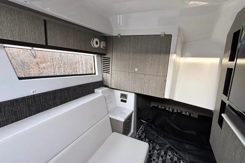  Yacht Photos Pics 2026 Monterey 385 Super Express cabin interior with modern seating and cabinetry.