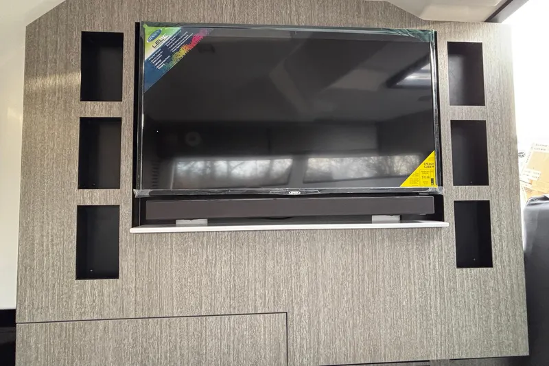  Yacht Photos Pics Entertainment center with TV in 2026 Monterey 385 Super Express yacht interior.