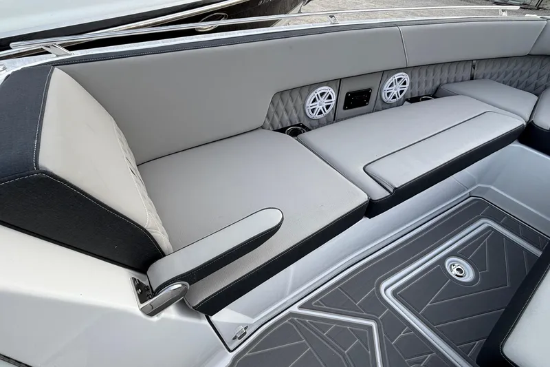  Yacht Photos Pics Luxurious seating area on 2026 Monterey 385 Super Express boat with speakers and armrest.