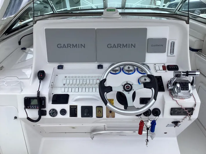  Yacht Photos Pics 2008 Donzi 38 ZSF boat dashboard with Garmin navigation system and steering wheel.