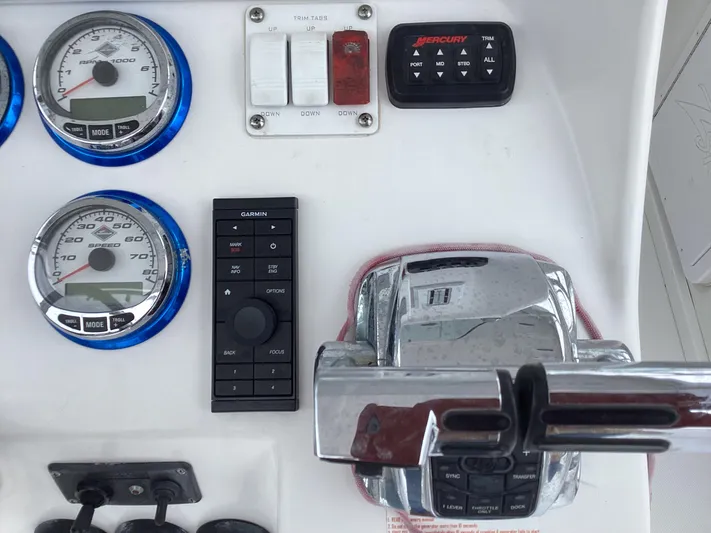  Yacht Photos Pics Control panel of a 2008 Donzi 38 ZSF boat with gauges and throttle.