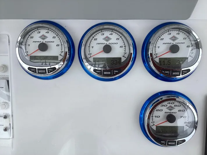  Yacht Photos Pics Dashboard gauges of a 2008 Donzi 38 ZSF boat, displaying RPM and speed.