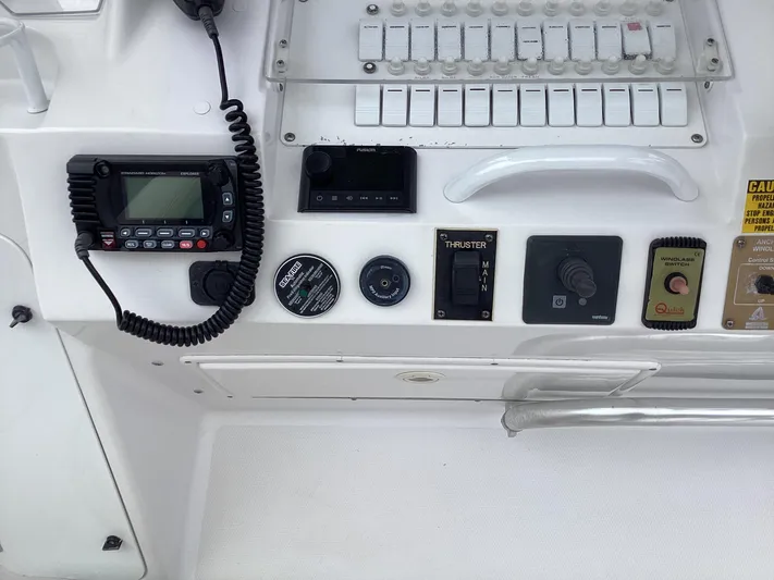  Yacht Photos Pics Control panel of a 2008 Donzi 38 ZSF boat with various switches and devices.