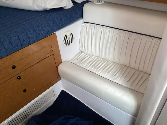  Yacht Photos Pics Interior of 2008 Donzi 38 ZSF boat with white seating and wooden cabinetry.